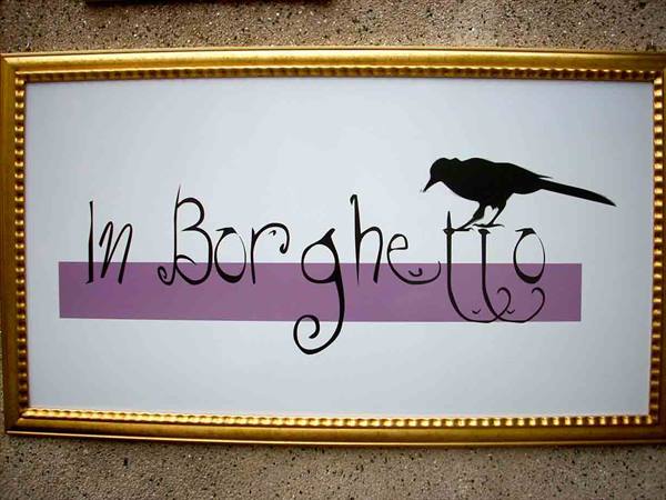 The logo of the Ristorante In Borghetto with the Tuchino