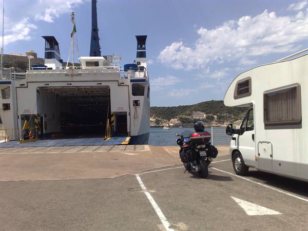 Motorcycle and camper wait to board the ferry at the port