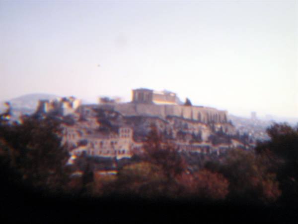 The Acropolis of Athens above trees, faded archival photo
