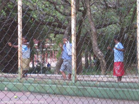 Behind the net