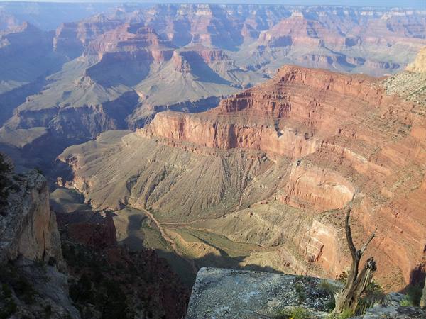 Grand Canyon: layered red rock cliffs under morning light