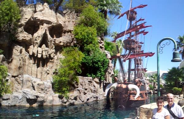 Couple beside pirate ship by skull rock, Treasure Island Las Vegas