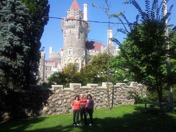 Tourists in front of Casa Loma stone wall, Toronto