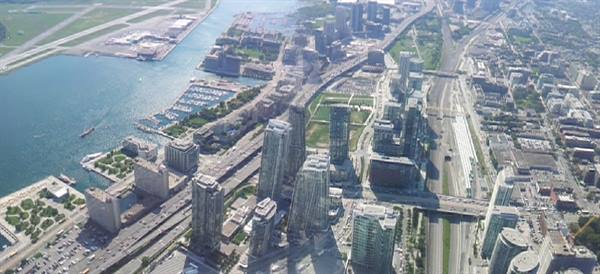 Aerial view of glass skyscrapers, highways and marina in Toronto