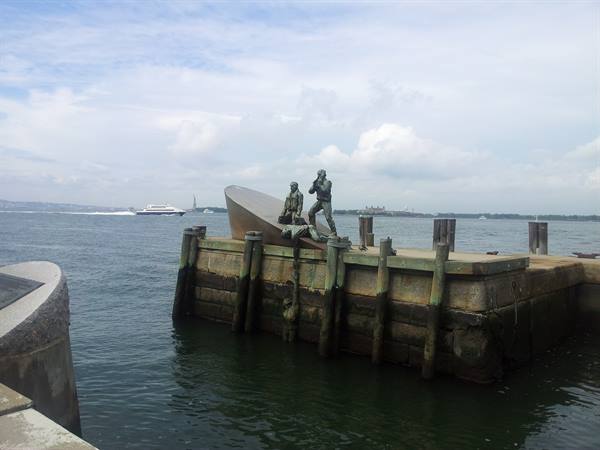 Merchant Mariners' Memorial at Battery Park, New York, with ferry in the harbor