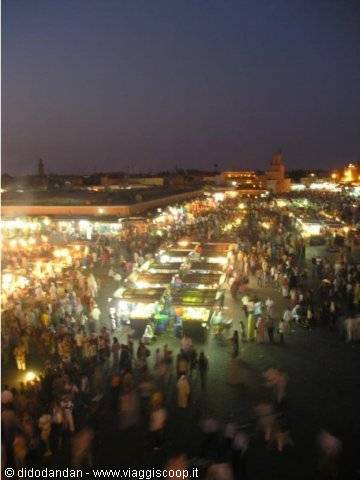 Crowd and lit food stalls at night in Jemaa el-Fna, Marrakech