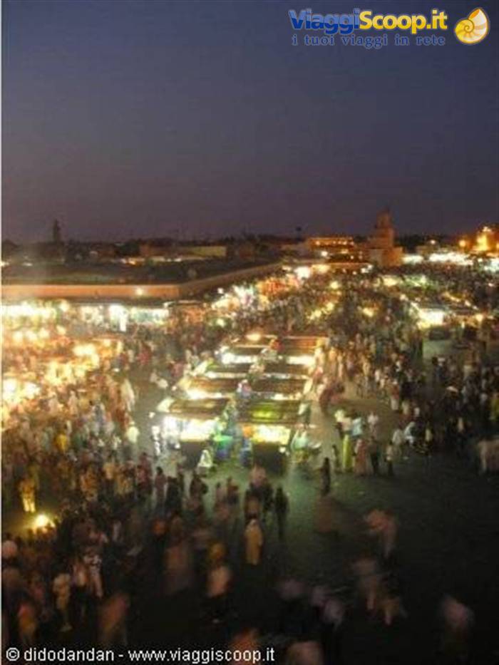 Crowd and lit food stalls at night in Jemaa el-Fna, Marrakech