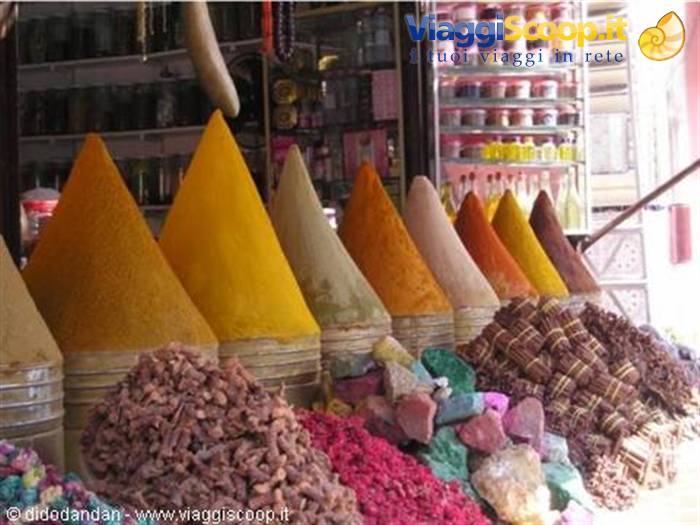 Colorful spice cones and soap stacks at Marrakech souk