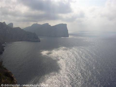Cap de Catalunya at Formentor, limestone cliffs over the sea under sunlit clouds
