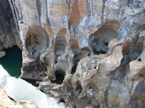 Bourke's Luck Potholes, swirling carved rock formations and a turquoise river