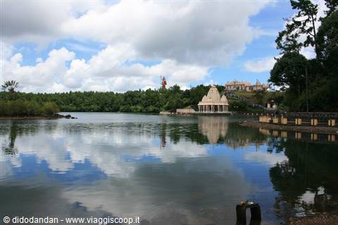 White Hindu temple reflected in the sacred Ganga Talao lake