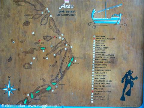 Hand-painted wooden dive site map of Asdu with boat and diver