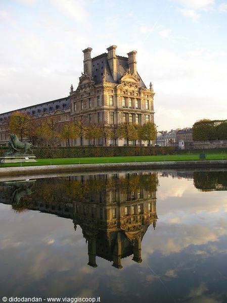 The Louvre in Paris reflected in the Tuileries garden pond