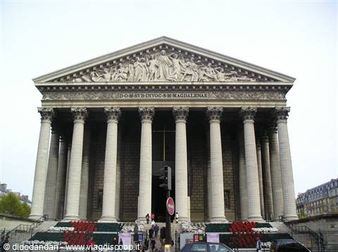 La Madeleine church in Paris, Corinthian columns and sculpted pediment under grey sky
