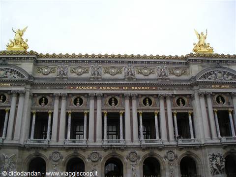 Facade of the Palais Garnier in Paris, golden statues and music academy inscription