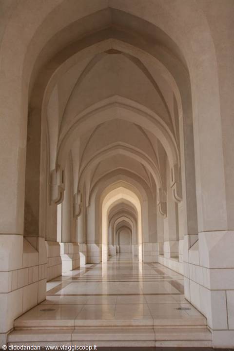 Corridor of pointed arches in white marble, soft light