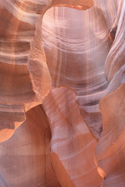 Wavy orange sandstone walls carved by water, Antelope Canyon