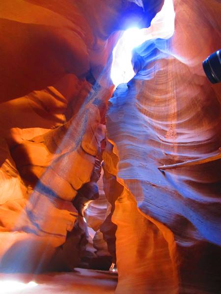 Sunbeam falling through the carved sandstone walls of Antelope Canyon