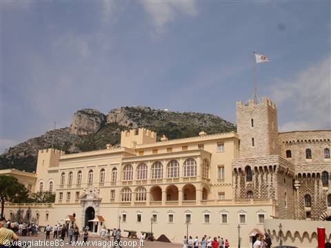 Tourists on the square before the Prince's Palace of Monaco, flag tower