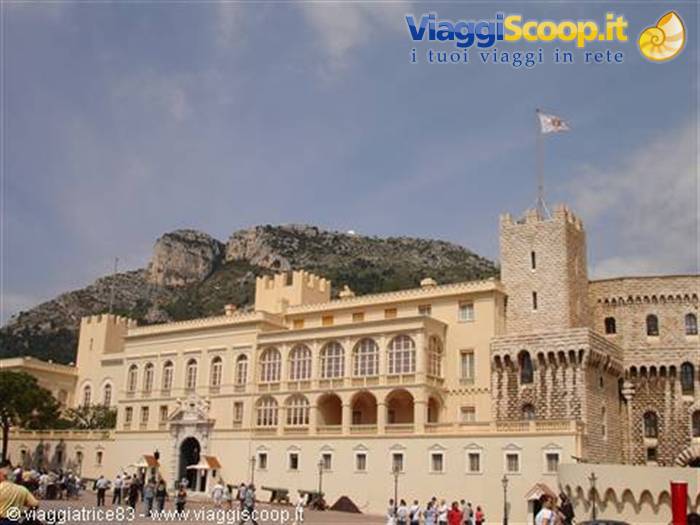 Tourists on the square before the Prince's Palace of Monaco, flag tower