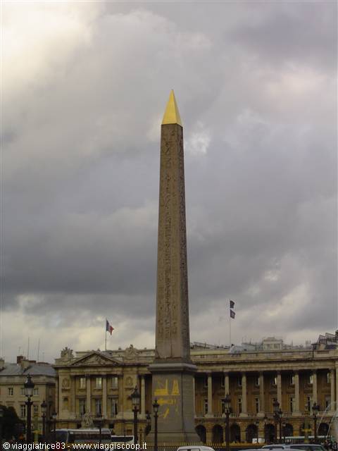 Luxor Obelisk with golden tip at Place de la Concorde, cloudy sky
