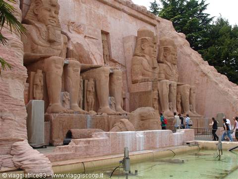 Visitors walking past replica colossal statues of Ramses II at Abu Simbel