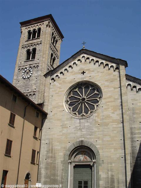 San Fedele Basilica in Como, stone facade with rose window and bell tower