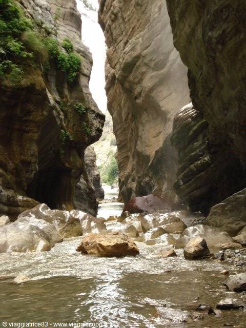 Alcantara Gorges: smooth basalt rocks and stream between narrow walls