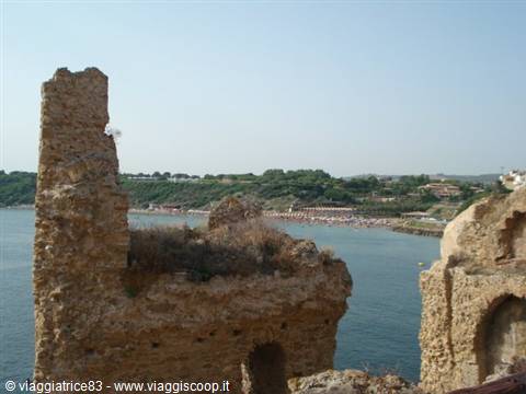 Stone ruins of Le Castella castle overlooking calm blue sea