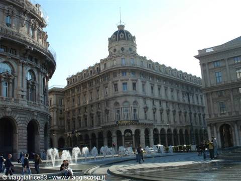 Piazza de Ferrari in Genoa, marble fountains among historic buildings