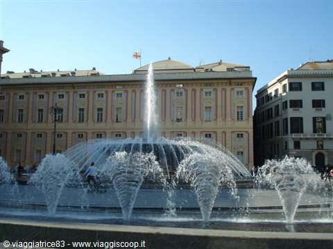 The large fountain of Piazza De Ferrari in Genoa under the sun