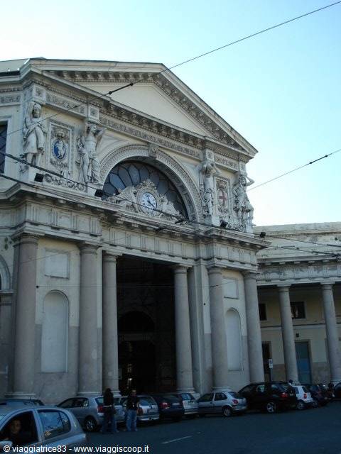 Neoclassical facade of Genoa Piazza Principe station with statues and clock