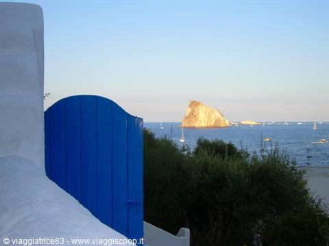 a blue door on the sea..