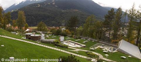 Merano Thermal Baths gardens, spa pools on the green lawn among mountains