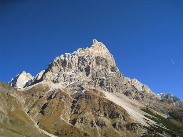 Cimon della Pala, snowy dolomite rock walls under deep blue sky
