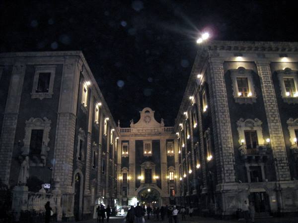 Baroque palace lit at night in Piazza Università, Catania