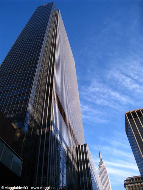 Glass skyscrapers in New York with the Empire State Building in the background