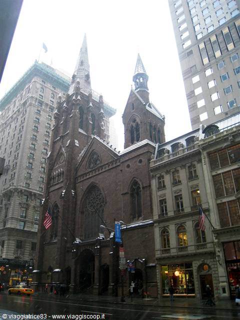 Gothic brownstone church with spires among New York skyscrapers