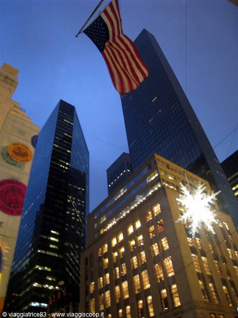 American flag and skyscrapers on Fifth Avenue, New York, holiday decorations