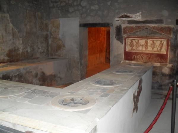 Thermopolium of Vetutius Placidus in Pompeii, masonry counter with embedded dolia and fresco