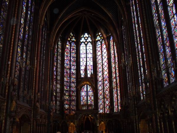 Sainte-Chapelle: Gothic stained glass windows light the stone apse