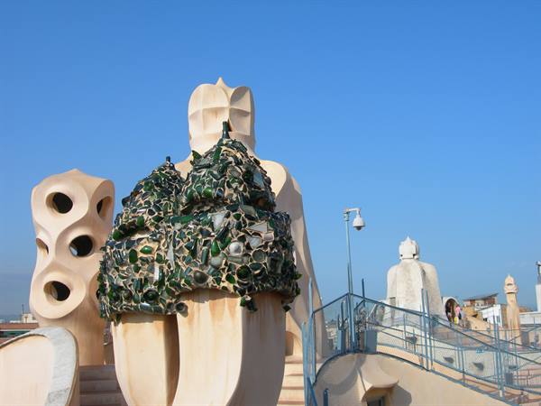 Gaudí chimneys with green glass mosaic on La Pedrera rooftop, Barcelona
