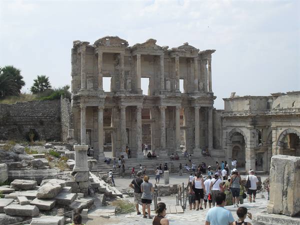 Tourists among the marble ruins of the Library of Celsus in Ephesus