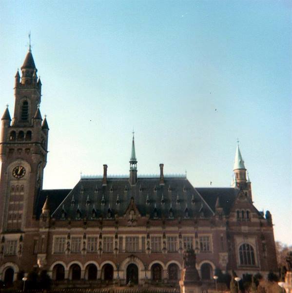 Peace Palace in The Hague, clock tower under clear morning light
