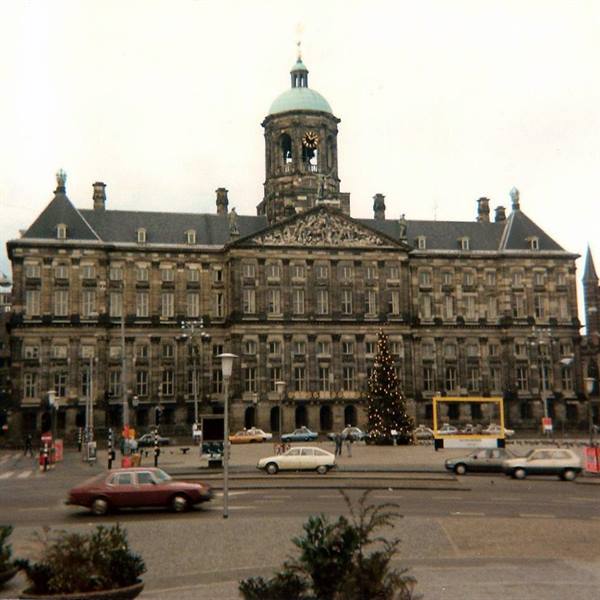 Royal Palace on Dam Square, Amsterdam, with Christmas tree and vintage cars