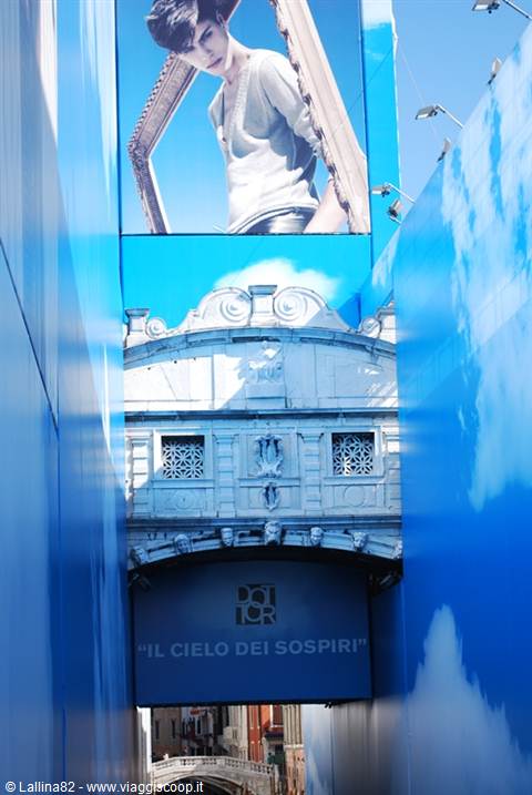 Bridge of Sighs wrapped in blue Dior advertising, painted sky on scaffolding
