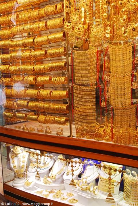 Gold bangles and necklaces displayed in the window of Dubai's Gold Souk