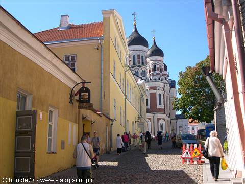 Tourists on the cobbled street toward the Alexander Nevsky Orthodox cathedral in Tallinn