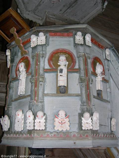 Painted wooden pulpit with carved saints and angels, medieval church