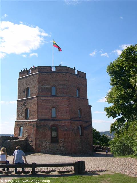 Red brick tower with Lithuanian flag, tourists on top, Gediminas Tower Vilnius